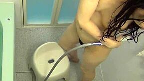 asian teen rubs herself after outdoor shower