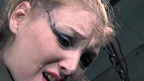 stockinged bdsm sub caned while bound in pillory