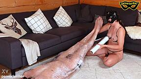 Slave bound in cage stimulated with pain before orgasm
