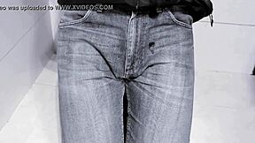 amateur pees in jeans while on toilet