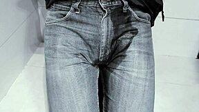 amateur pees in jeans while on toilet