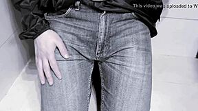 amateur pees in jeans while on toilet