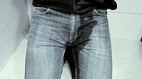 amateur pees in jeans while on toilet