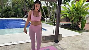 perfect body blonde doing explicit yoga outdoors by pool