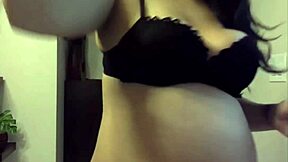 Pregnant cutie shows sexy belly