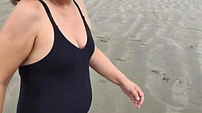 stepmother flashes tits on beach during mutual masturbation