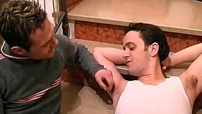 Hot twinks make out and jerk off together on the staircase in close up