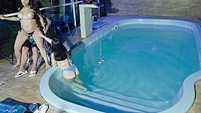 two brunettes masturbate at the condo pool