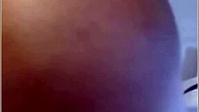 Hot tanned caribbean woman enjoys the beach. She relaxes under the sun