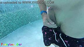 Gay guy cheekily jerks off fat cock in public thermal pool underwater