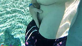 Gay guy cheekily jerks off fat cock in public thermal pool underwater