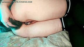 This girl plays with her ponytail in the ass and masturbates a rubber cock