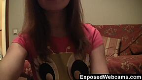 Teen redhead undresses on sofa, rips clothes while masturbating solo