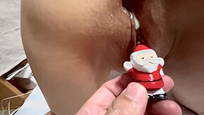 Santa Claus toys with a wet Asian milf's shaved pussy