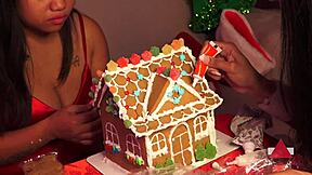 Making a gingerbread house with girlfriend and friend on christmas