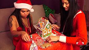 Making a gingerbread house with girlfriend and friend on christmas