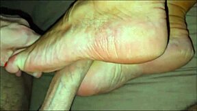 Blonde stepmom fingers her pussy while barefoot in panties for foot fetish fans.