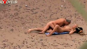 A passionate beach encounter between an older man and a hot milf on the ocean shore