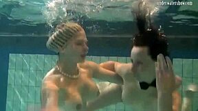 Bouncing Tits Lesbians Katka and Barbara Dive Deep in Pool Play.