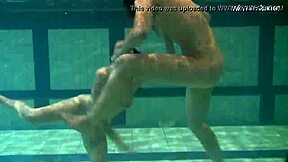 Bouncing Tits Lesbians Katka and Barbara Dive Deep in Pool Play.