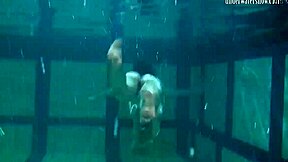 Bouncing Tits Lesbians Katka and Barbara Dive Deep in Pool Play.