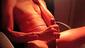 Muscular guy jerks off with intense moans and cum