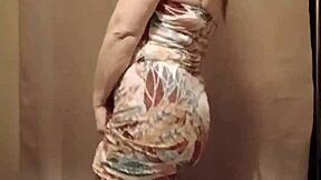 French milf slave teases with strip show outdoors