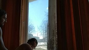 Helga bosk having risky bareback sex by the window with passersby watching