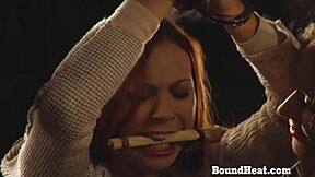 A submissive lesbian slave gives a hot oily massage to the dominant madame. The scene unfolds in a private room with bound elements.