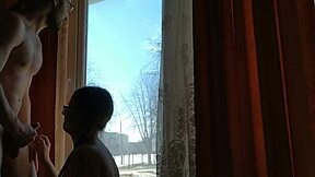 Helga bosk having risky bareback sex by the window with passersby watching