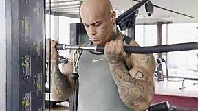 sexy tattooed bodybuilder does light leg training for the first time