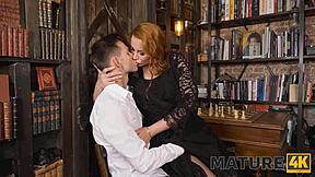 Busty Mature Redhead Plays With Stud's Penis Instead Of Chess On Desk