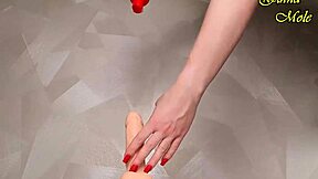 hot milf in red fishnets rides dildo