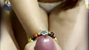 asian thai teen keeps stroking boyfriend's cock after cumshot
