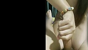 asian thai teen keeps stroking boyfriend's cock after cumshot