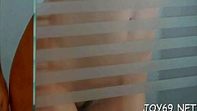 pretty young woman relaxes alone by gently touching herself in a private moment. she uses a dildo to ease the itch