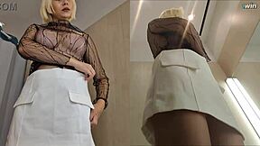 hidden camera captures raw upskirt view of big tits in locker room.