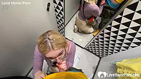 gf gives a blowjob in the changing booth