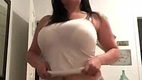 milf with tattoos slowly strips revealing big tits at home