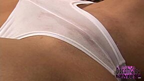 Tanned brunette in lingerie masturbates with vibrator on shaved pussy