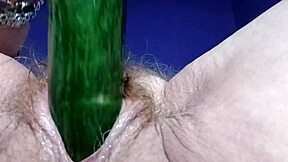 German granny fucks hairy pussy and ass with cucumber in raw action.