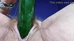 German granny fucks hairy pussy and ass with cucumber in raw action.