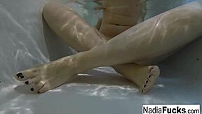 Sexy Nadia enjoys a playful bath with rubber duckies