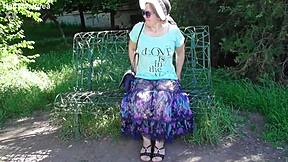 Chubby Hairy Mature Woman in Transparent Dress Exposes Her Beaver in Public Outdoor Setting