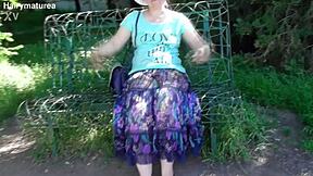 Chubby Hairy Mature Woman in Transparent Dress Exposes Her Beaver in Public Outdoor Setting