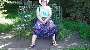 Chubby Hairy Mature Woman in Transparent Dress Exposes Her Beaver in Public Outdoor Setting