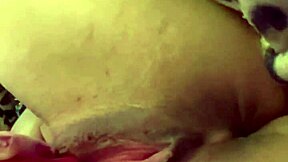 she uses vibrator on swollen pussy until she cums