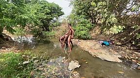 curvy ebony flashing outdoors, ready for devouring at the stream