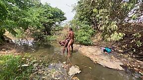 curvy ebony flashing outdoors, ready for devouring at the stream