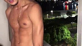 Naughty boy jerks off at the building window with tattoos